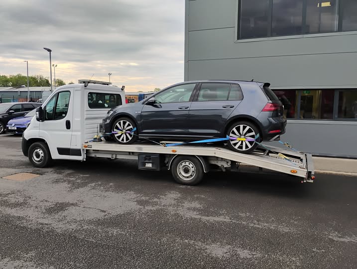 Grey VW Golf loaded on Ian's transporter, collected from a Hereford dealership for delivery to Godalming, Surrey