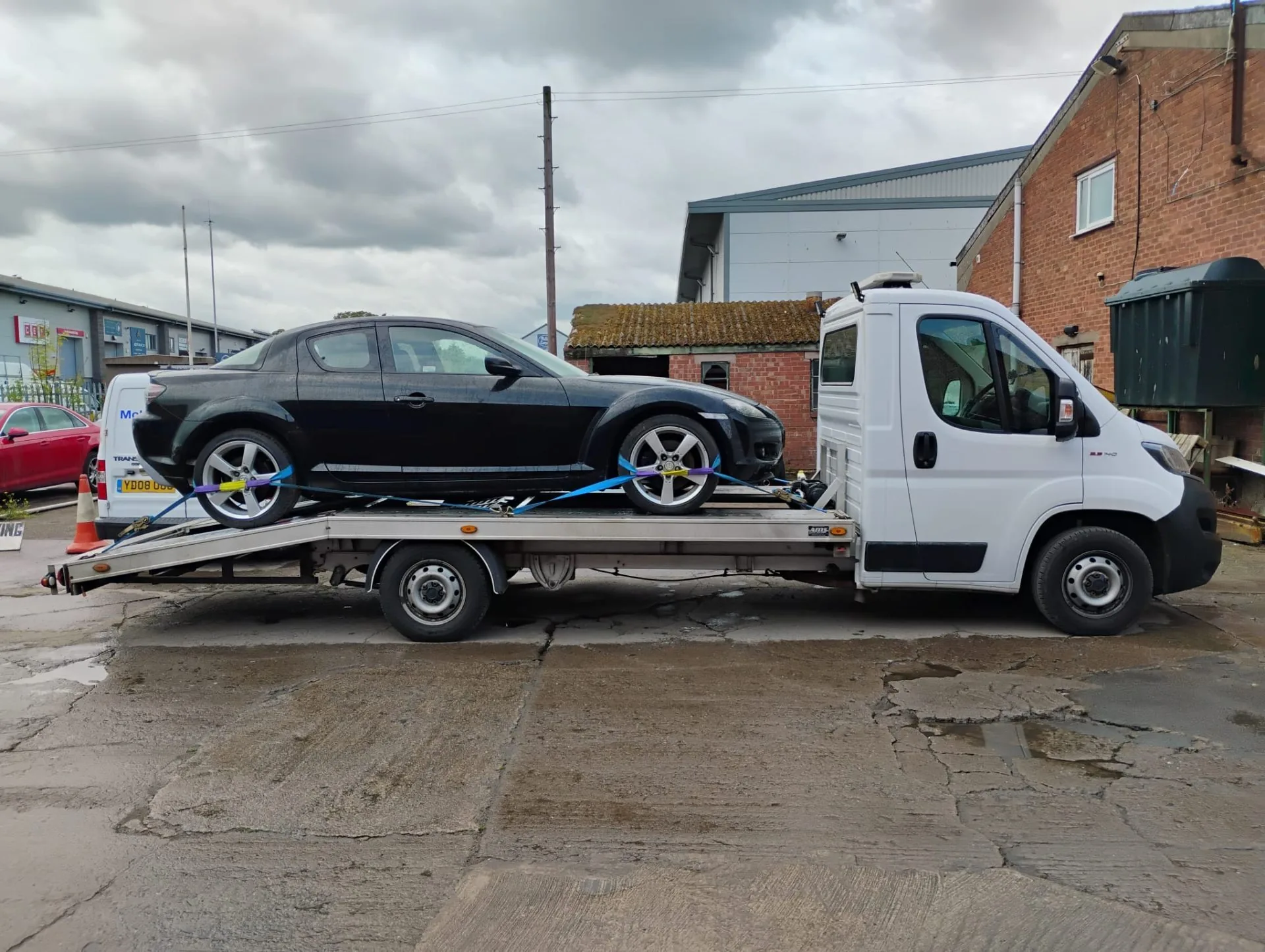 Mazda RX-8 loaded on transporter ready for delivery