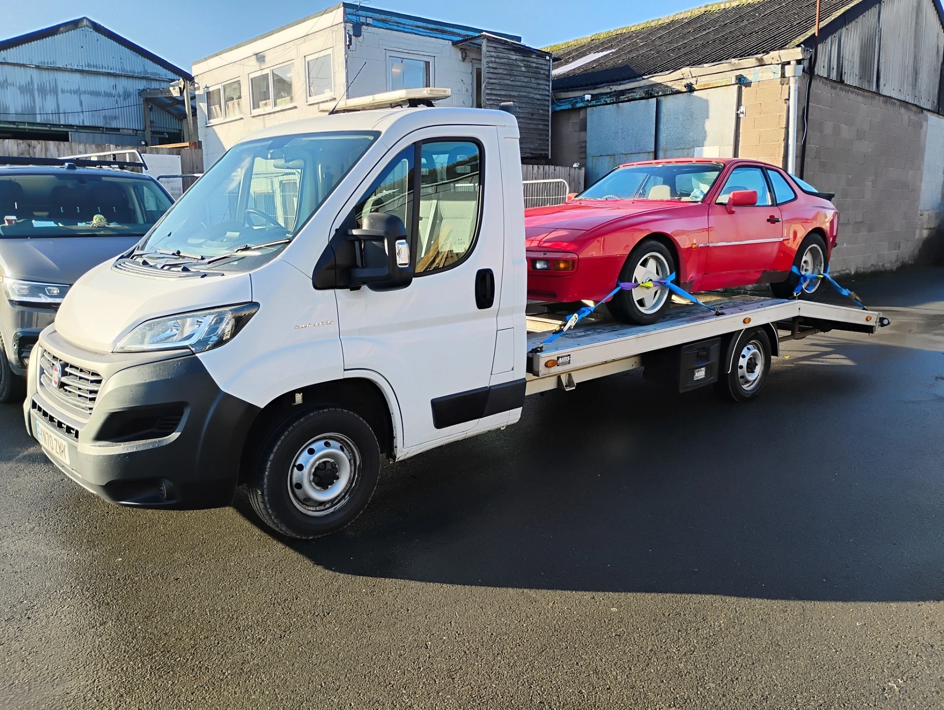 Red Porsche 944 ready for delivery