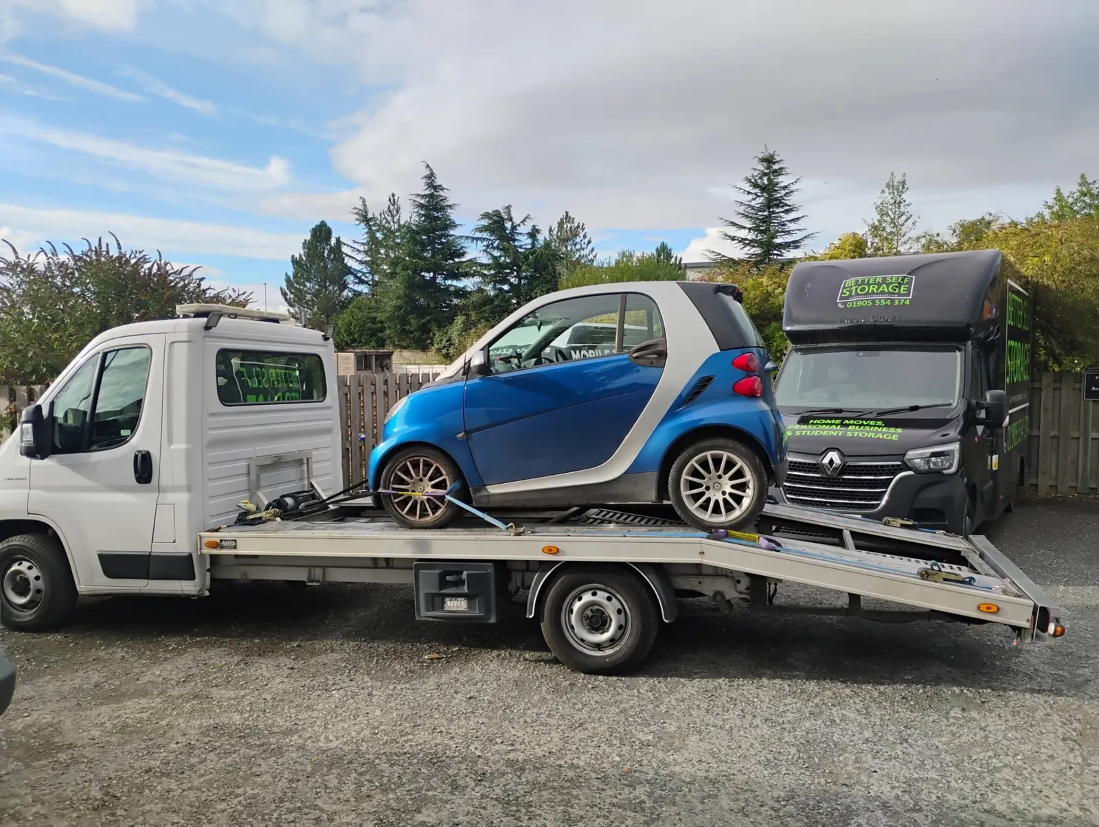 Blue Smart ForTwo loaded for delivery to storage