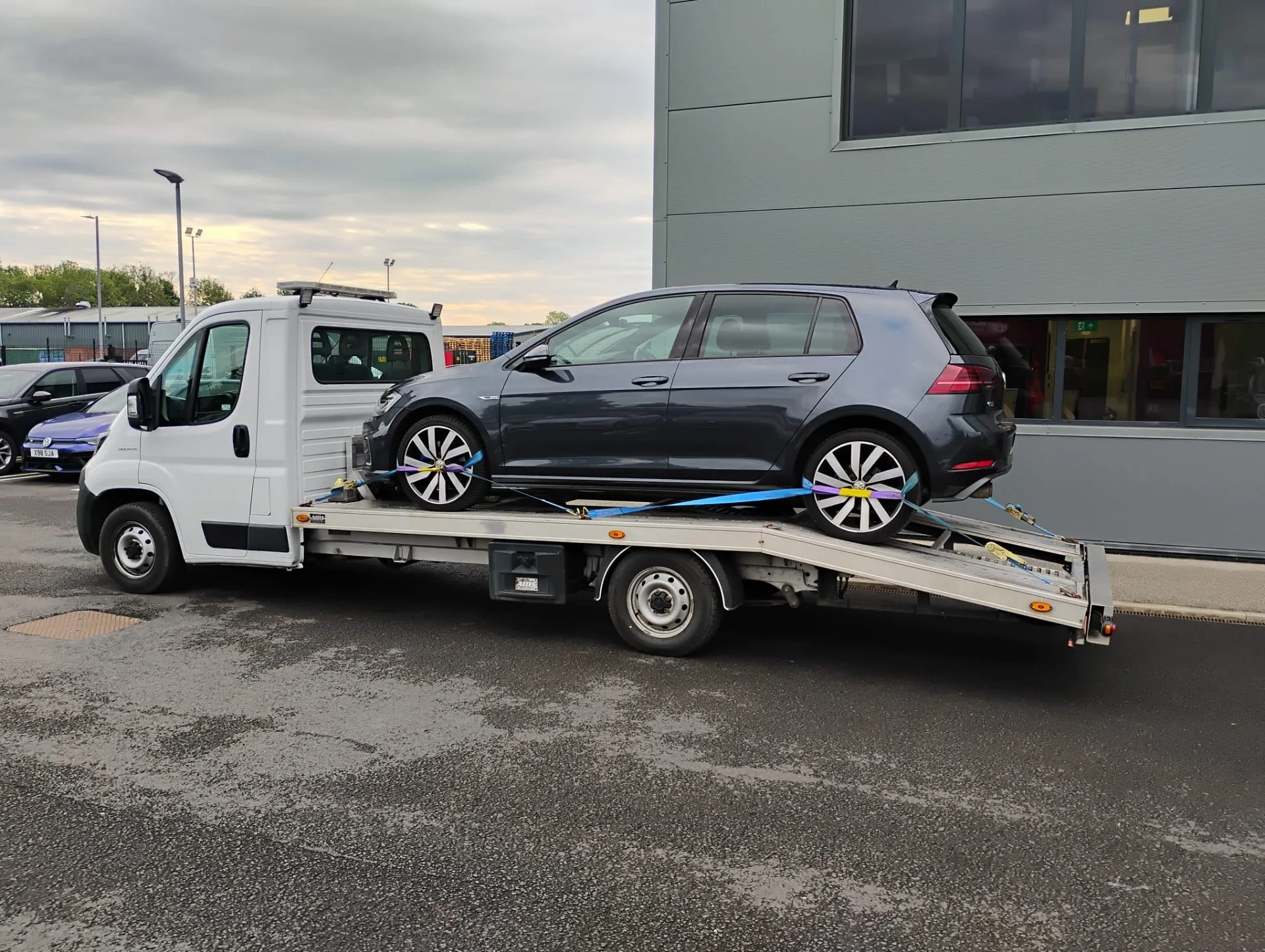 Volkswagen Golf being transported on flatbed